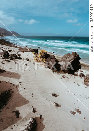 Huge volcanic stone boulder on spectacular white Huge volcanic stone boulder on spectacular white 38991419