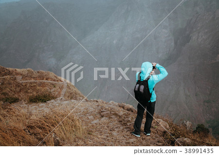Man in high altitude rocky mountain landscape in Man in high altitude rocky mountain landscape in 38991435