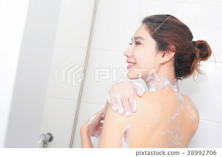 Beautiful girl washing body shower gel in bathroom Beautiful girl washing body shower gel in bathroom 38992706