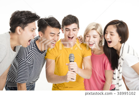 Group of happy friends singing song together. Group of happy friends singing song together. 38995102