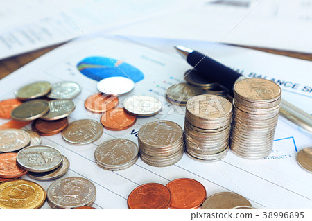 Close up pen and compass and coin stack on income Close up pen and compass and coin stack on income 38996895