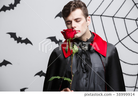 Vampire Halloween Concept - Portrait of handsome Vampire Halloween Concept - Portrait of handsome 38999914