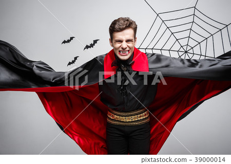Vampire Halloween Concept - Portrait of handsome Vampire Halloween Concept - Portrait of handsome 39000014