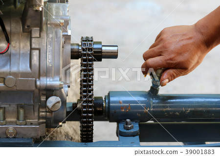 Asian people are repair or maintenance boat engine 39001883