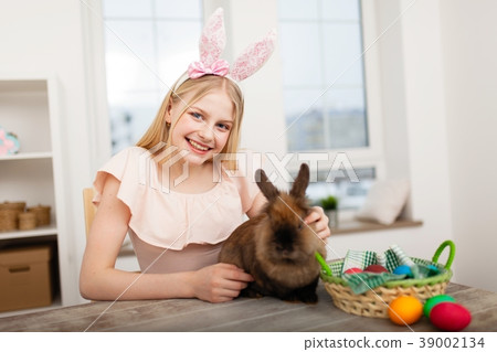 Teenage girl holding Easter eggs 39002134