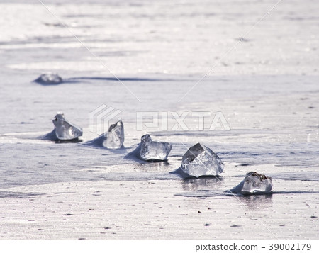 Transparent ice block on frozen sea surface Transparent ice block on frozen sea surface 39002179