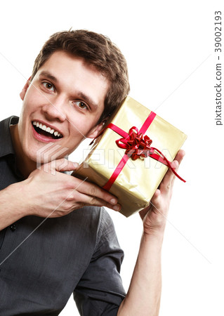 Holiday. Man got golden gift box with red ribbon Holiday. Man got golden gift box with red ribbon 39002193