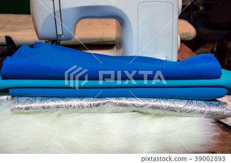 Sewing machine and colored fabric. 39002893