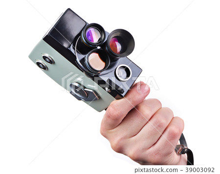 Retro movie camera in hands of operator isolated Retro movie camera in hands of operator isolated 39003092