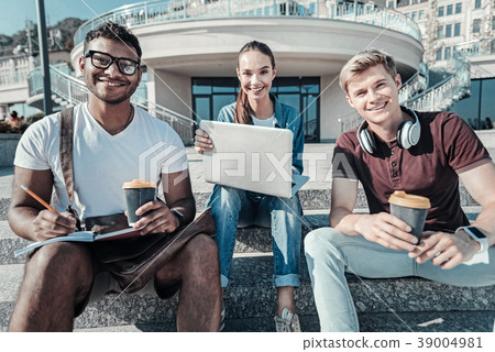Joyful young students looking at you 39004981
