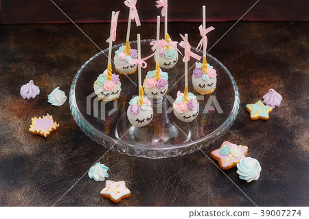 Sweet cake pops with faces on wooden background Sweet cake pops with faces on wooden background 39007274