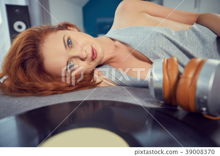 the image of resting sexy woman listening to vinyl 39008370