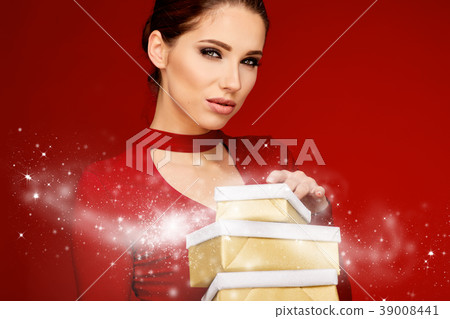 Woman with christmas box gift Woman with christmas box gift 39008441