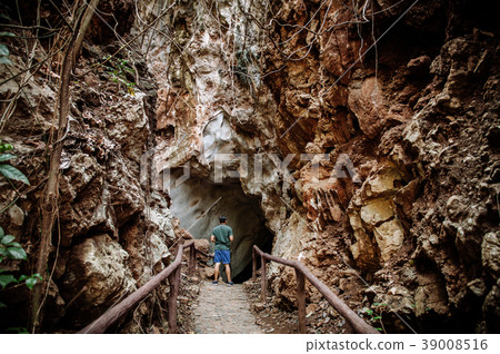 Young asian male in forest cave travel in nature Young asian male in forest cave travel in nature 39008516