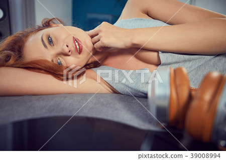 the image of resting sexy woman listening to vinyl 39008994