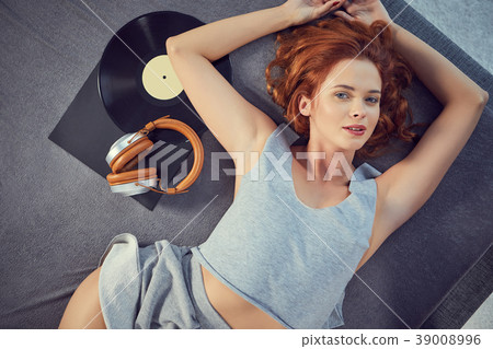 the image of resting sexy woman listening to vinyl the image of resting sexy woman listening to vinyl 39008996