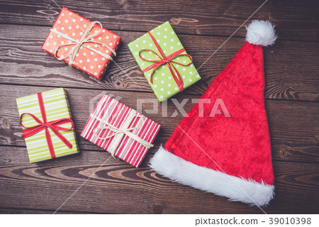 Santa Claus red hat with colorful gift boxes 39010398