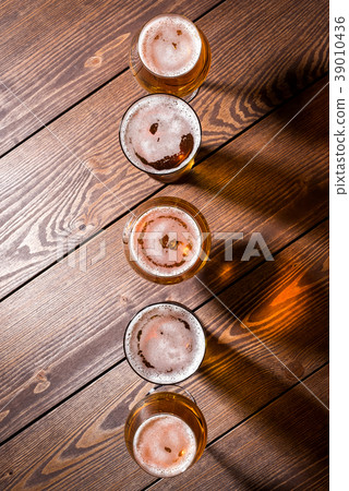 Beer glasses on wooden table. Close up 39010436