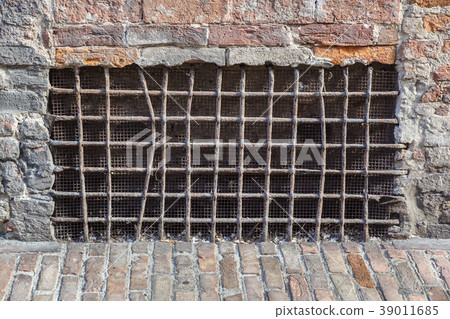 old basement window with a lattice, covered with old basement window with a lattice, covered with 39011685