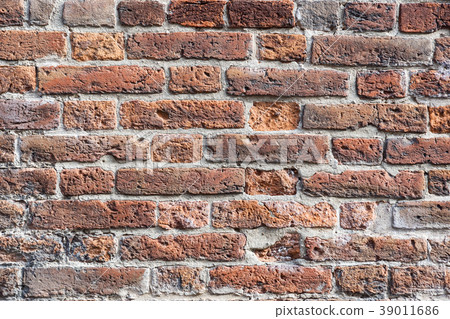 Weathered stained old brick wall background Weathered stained old brick wall background 39011686