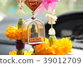 Belief and Miniature God hung in a car. 39012709
