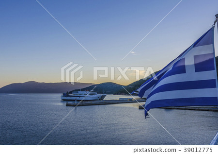 greece flag flies Sami harbor on Kefalonia island 39012775