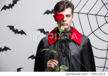 Vampire Halloween Concept - Portrait of handsome Vampire Halloween Concept - Portrait of handsome 39012825