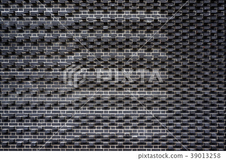Modern black brick wall pattern.  39013258