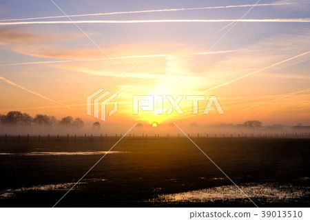 Natural dramatic sunrise sky over the countryside Natural dramatic sunrise sky over the countryside 39013510