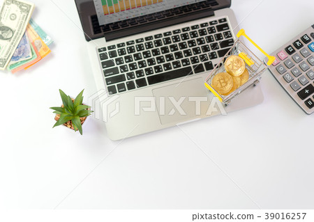 bitcoin in shopping cart on laptop concept online bitcoin in shopping cart on laptop concept online 39016257