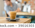 Hot coffee cup on wooden table 39016303