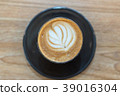 Hot coffee cup on wooden table 39016304