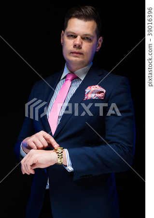 Portrait of confident handsome businessman showing Portrait of confident handsome businessman showing 39016396