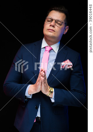 Portrait of confident handsome businessman showing 39016448