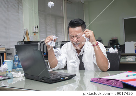businessman working in office having a stress. 39017430