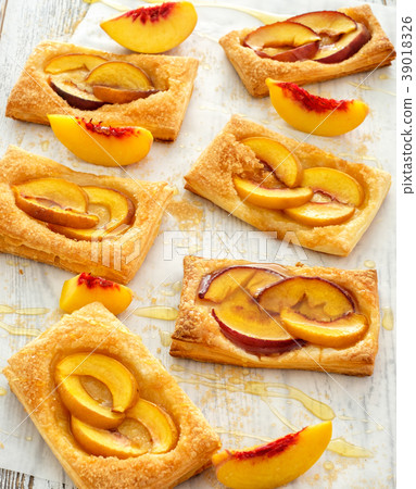 Tasty fresh homemade puff pastry with peach Tasty fresh homemade puff pastry with peach 39018326