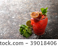 Fresh fruit cocktail on a dark background. 39018406