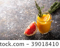 Fresh fruit cocktail on a dark background. 39018410
