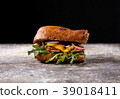 Sandwich with chicken, onion, greens and pickles 39018411