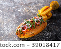 Big hot dog with greens, onion and jalapeno pepper 39018417