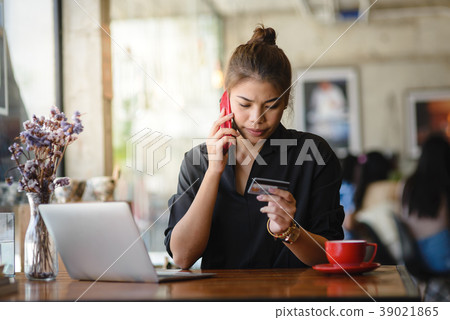 Asian woman call to bank call center for card  39021865
