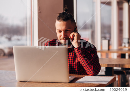 Modern hipster businessman using mobile phone 39024019