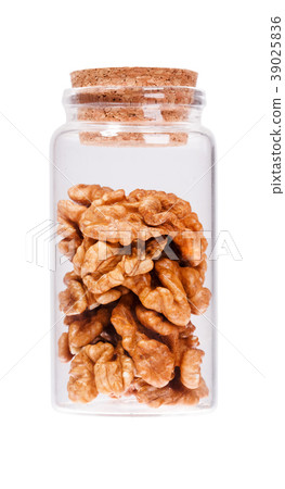 Walnut in a glass bottle with cork stopper 39025836