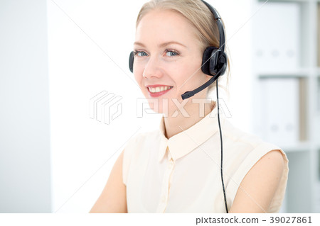 Image of bright call center. Focus on young Image of bright call center. Focus on young 39027861
