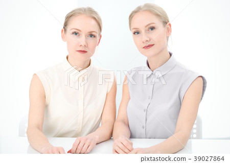 Two business ladies or colleagues discussing Two business ladies or colleagues discussing 39027864