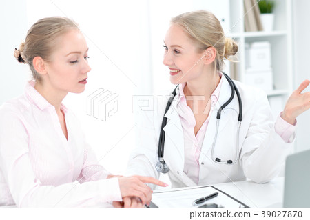 Doctor and patient during personal consulting in Doctor and patient during personal consulting in 39027870