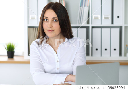 Young beautiful business woman or confident female Young beautiful business woman or confident female 39027994