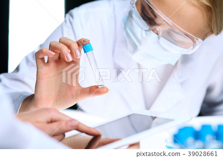 Closeup of scientific research team with clear 39028661