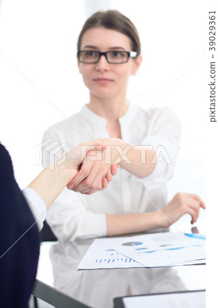 Close Up of unknown business people shaking hands Close Up of unknown business people shaking hands 39029361