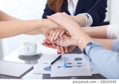 Close Up of unknown business people joining hands 39029399